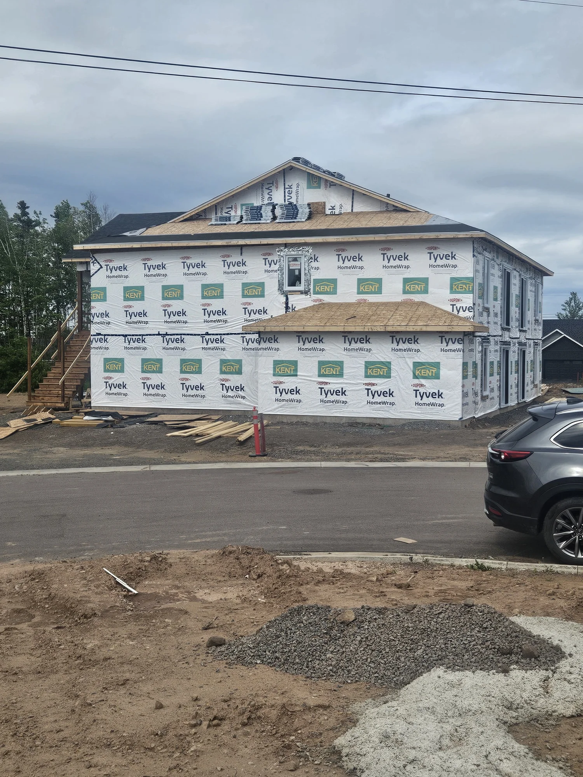 Two-storey four unit building framing completed ready for siding and roofing.